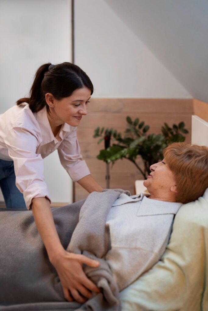 female caregiver taking care on an elderly patient