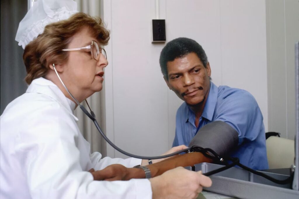 Woman Getting The Blood Pressure of A Patient 