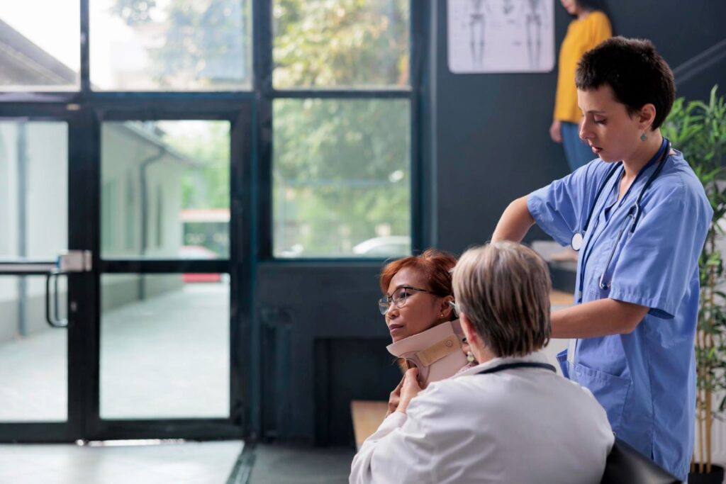 A woman having her neck checked in a clinic.