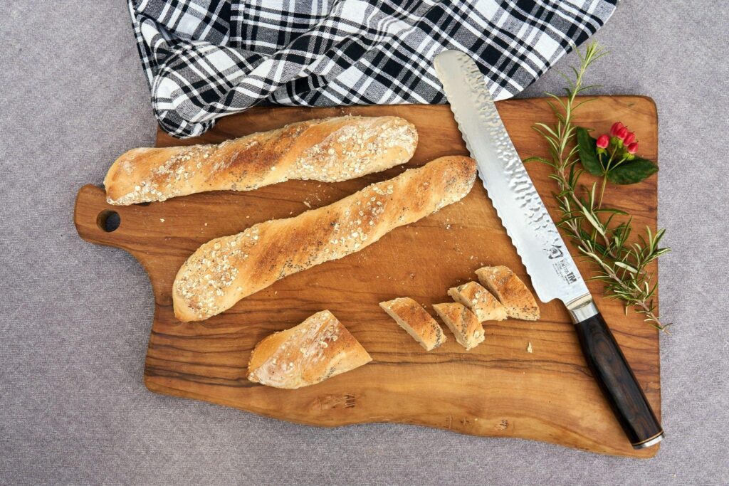 Sliced breadsticks on the chopping board.