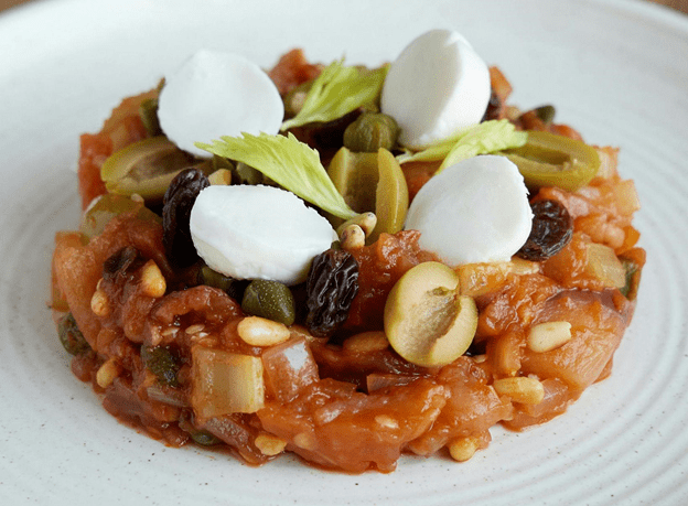 A photo of a Sicilian caponata on a plate.